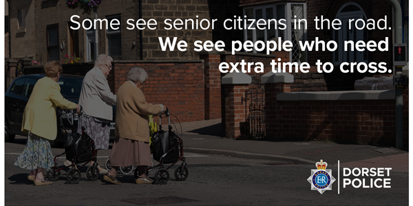 Older people crossing a road with walking frames